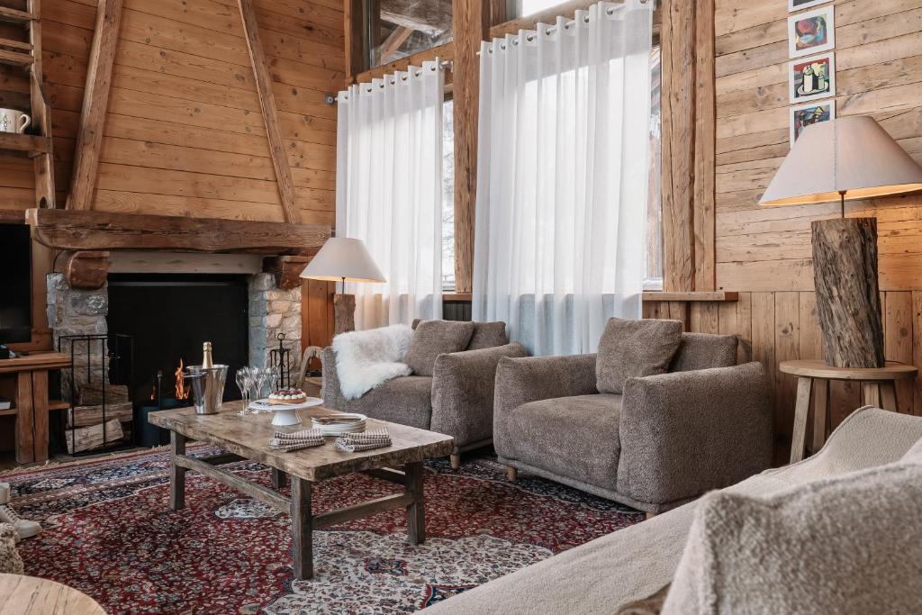 Chalet Alix — fireside living room with sheepskin armchairs