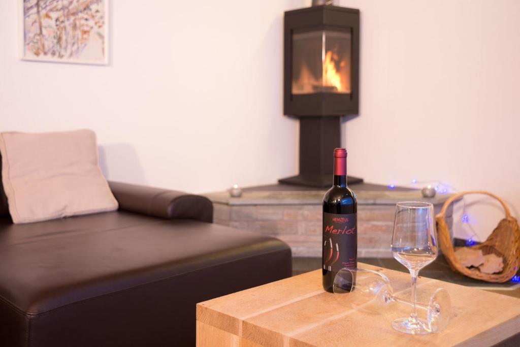 Chalet Talisman, Zermatt — fireside lounge corner with wine and stove
