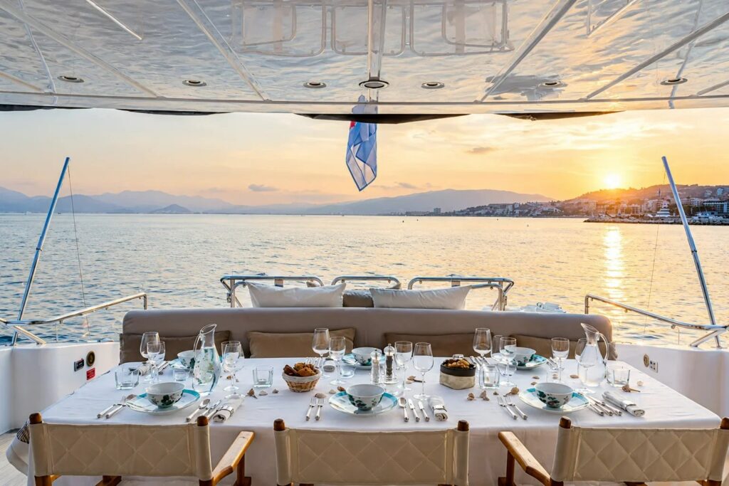 RAMSES II — main aft deck dining at sunset, charter Côte d'Azur