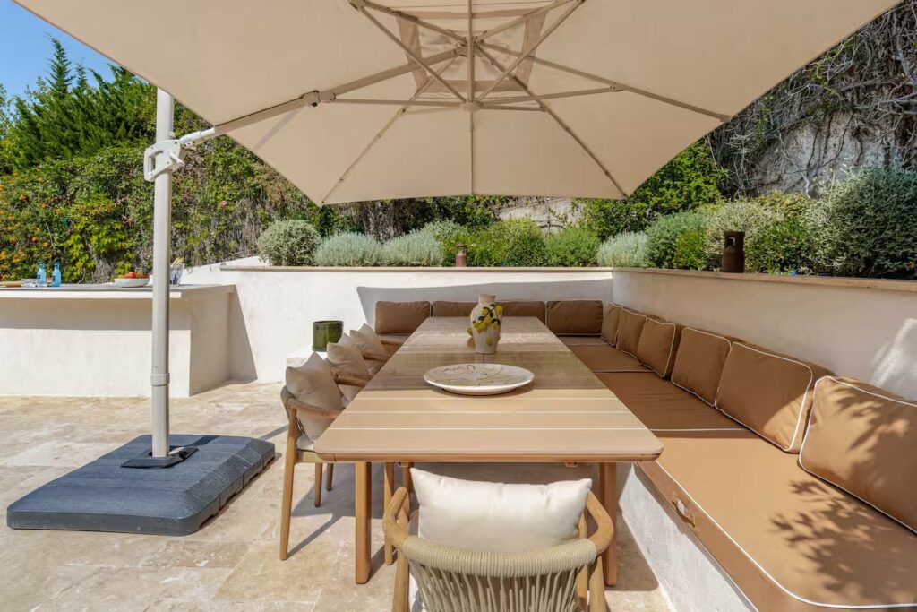 Villa Dolce Riviera — shaded outdoor dining area, luxury villa rental Cannes